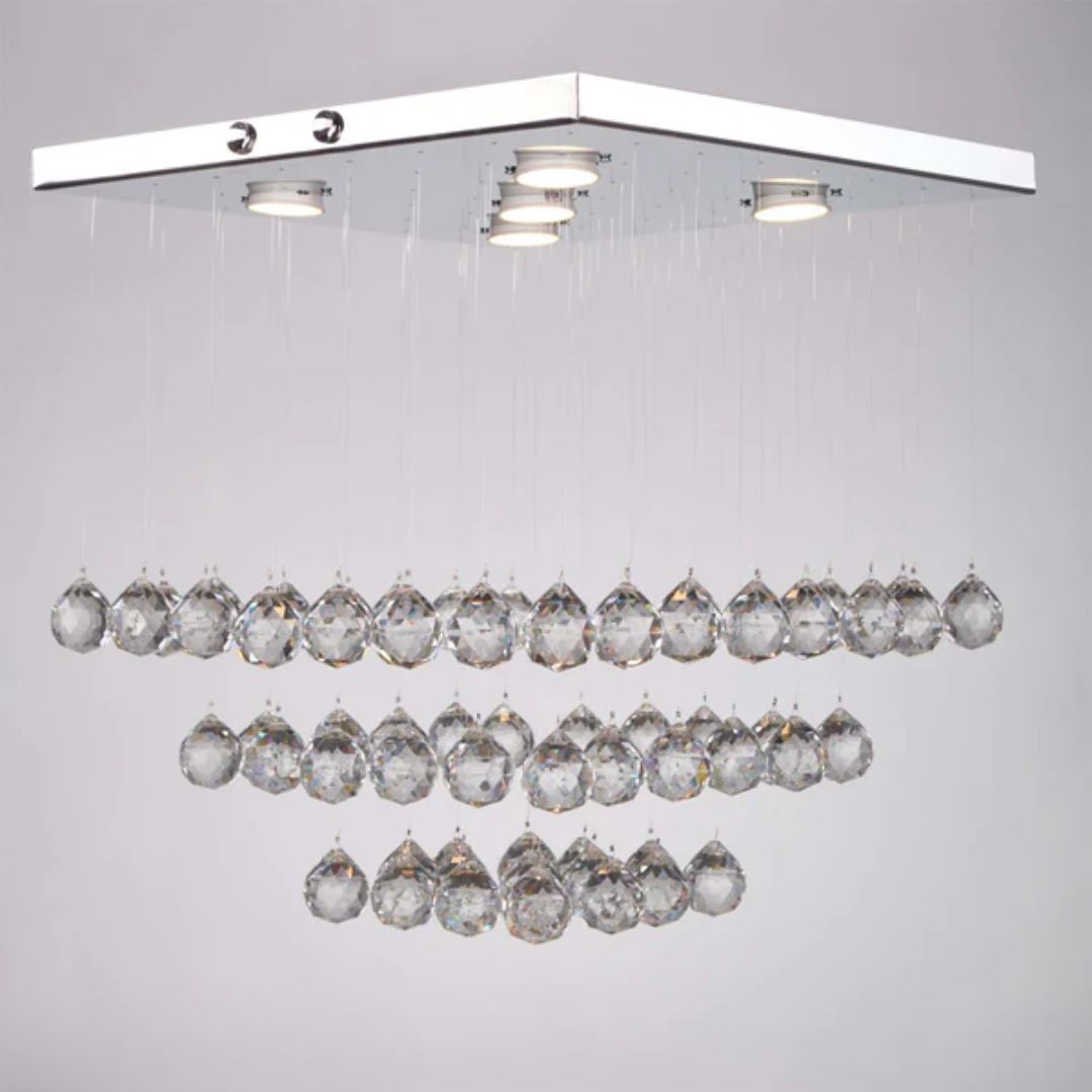 Stainless steel and crystal chandelier with a luxurious design that adds a touch of elegance.