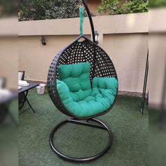 Single outdoor and indoor swing, pure rattan and sturdy iron frame – burnt brown rattan with green fabric
