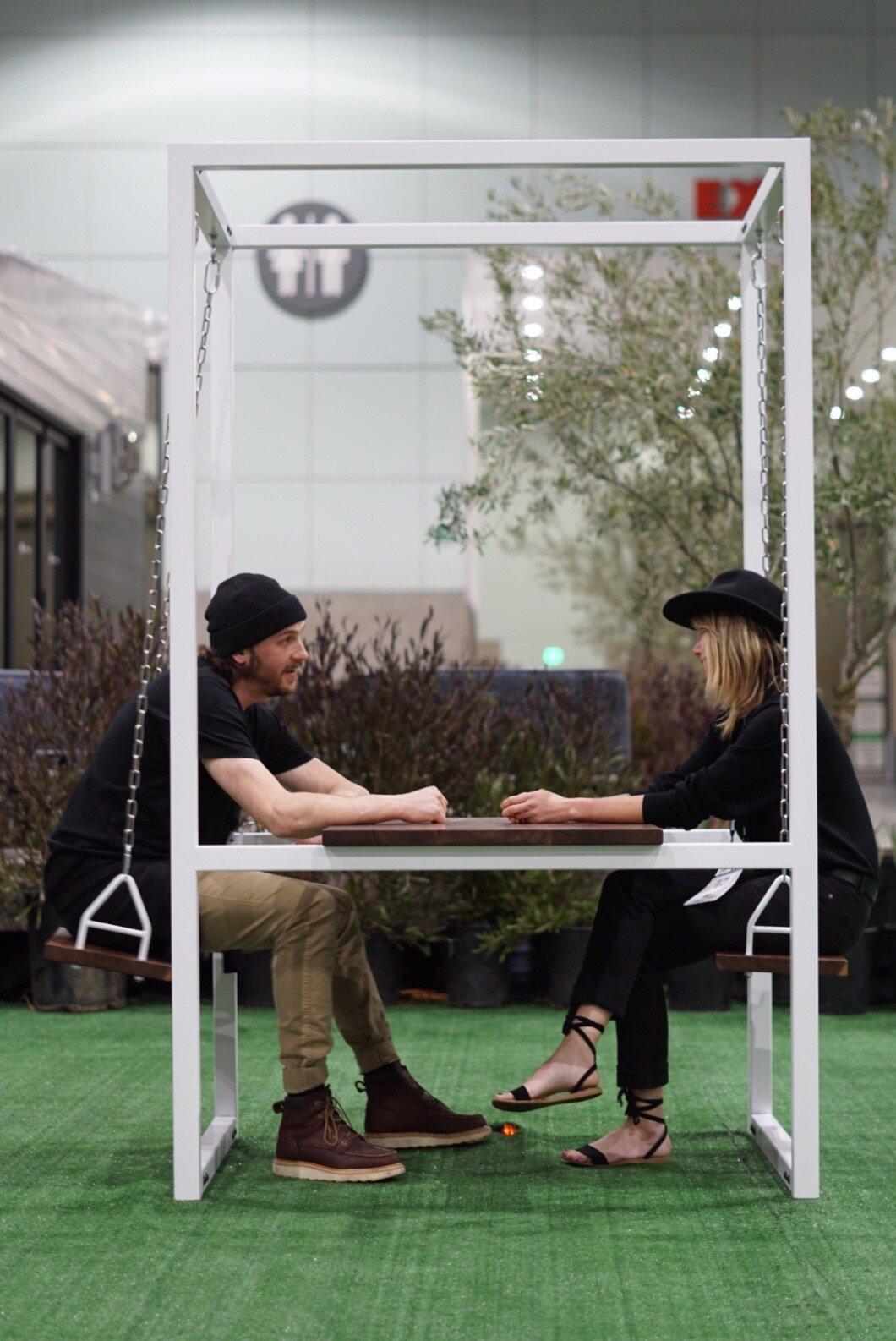 Outdoor beech wood table swing with a sleek white iron frame – perfect for gatherings and parties